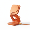 KUXIU 3-in-1 Wireless Charging Stand in orange metallic finish on white background